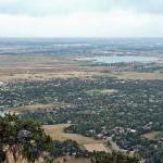 The city of Boulder, Colorado has spent several decades purchasing a miles-wide green belt of farms and open space around town. The results are clearly evident in this photo, taken from Mt. Sanitas at the city&#039;s western edge. However, the sprawl on the other side of the greenbelt (to the northeast) is also visible here.