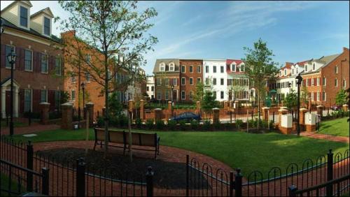 View from Inner Courtyard, looking at a mix of affordable and market flats and townhouses. A layer of parking is tucked under the courtyards.