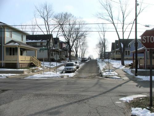 South Dunn Street is a two-block urban infill project in Bloomington, Indiana. Pictured here are the new street and first homes. Developer: Neighborhood Solutions (Matt Press). http://www.neighborhoodsolutions.info 
Homes designed by Kirkwood Design Studio.  
The project was publised in the Winter 2006 issue of American Bungalow magazine.