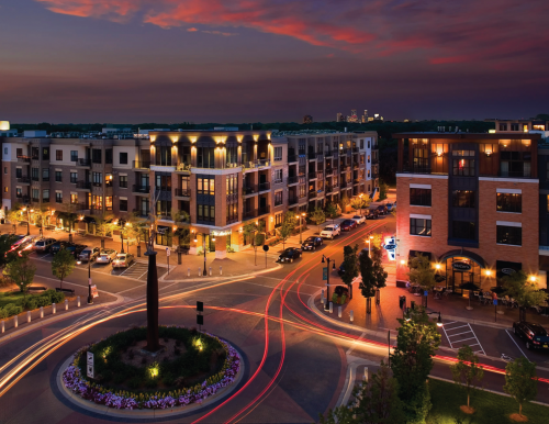 Dusk view of mixed-use retail and residential along Grand Way in St. Louis Park, Minn.