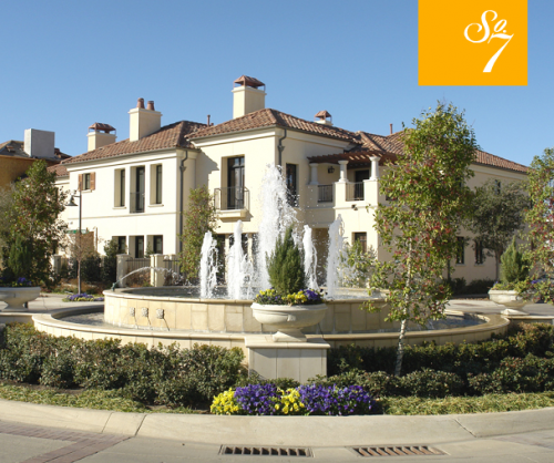 Exterior view of the Palladian-style townhomes at the SoSeven mixed-use development in Fort Worth, Texas.  The Townhomes at SoSeven are 59 luxury townhomes arrayed around a central roundabout & fountain in the southernmost part of the site.
