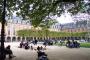 Children playing in a sandbox at the Place des Vosges, Paris.  A variety of activities are supported within a very formal landscape in this beautiful and well-defined square.  Note the walkable surfaces are pervious--trees grow directly from them.